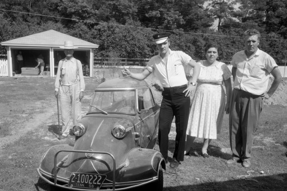 Elvis with parents Vernon, and Gladys in the backyard of the house at 1034 Audubon Drive, Memphis, Tennessee  with the Messerschmitt.