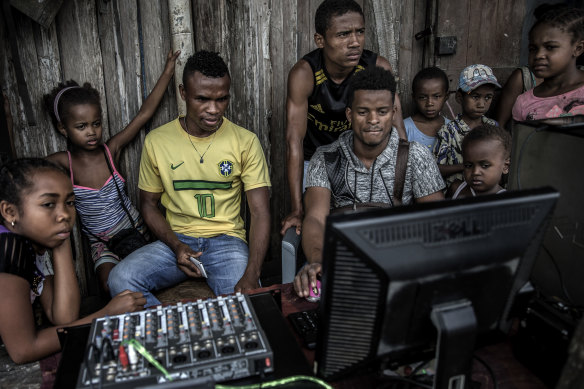 Young people at a computer during a weekly market in the Sava region of Madagascar, May 2018. Madagascar has little obvious strategic value for the Kremlin or the global balance of power. 