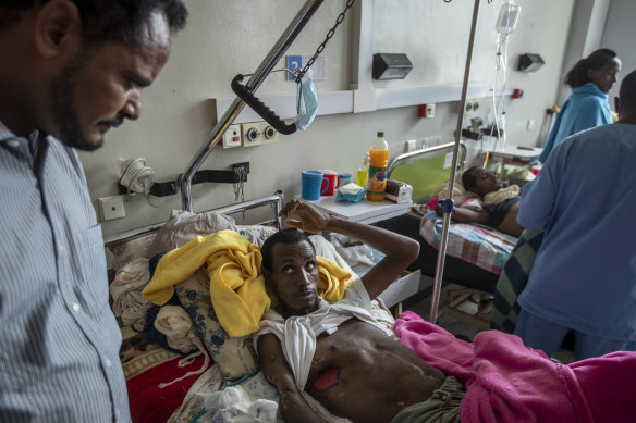 Farmer Teklemariam Gebremichael, seen in hospital in Mikele, says soldiers shot him and his cows. 
