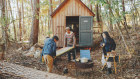 Yuichi Takeuchi and his children set up one of the movable little houses in the forests of Yamanashi Prefecture. 