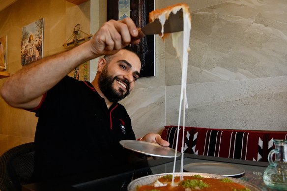 Mohammad Ismail with the first batch of Palestinian nabulsi knafeh at his Lakemba Nights stall.