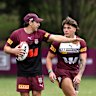Coach Billy Slater talks tactics with Reece Walsh.
