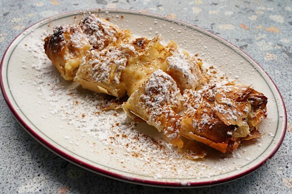 Custard-filled bougatsa dusted with icing sugar.