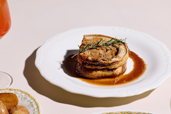 Porchetta rolled with garlic, fennel and pepper with a rosemary jus.
