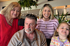 Elena and John Parolin, who were victims of a violent home invasion on March 30, pictured with their granddaughters.