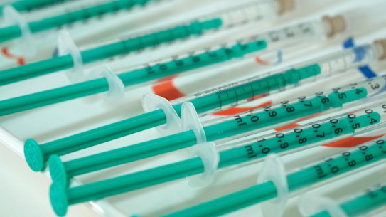 Syringes filled with doses of the AstraZeneca vaccine at a private medical practice in Germany. 