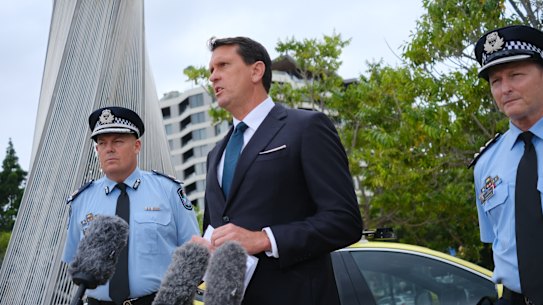 Queensland Police Minister Dan Purdie addresses media with senior police in Brisbane on Tuesday morning.