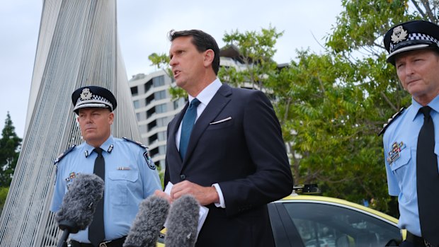 Queensland Police Minister Dan Purdie addresses media with senior police in Brisbane on Tuesday morning.