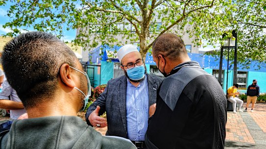 Imam Salih Dogan of the Dandenong Emir Sultan Mosque speaks at the Dandenong vaccination Hub on Sunday. 