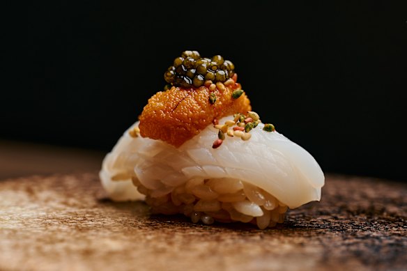 Squid nigiri with sea urchin and caviar, from the omakase menu.