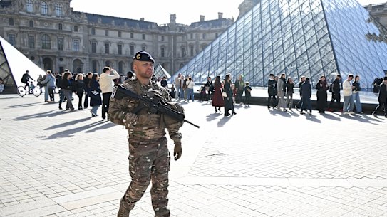 A soldier patrols in the courtyard of the Louvre museum on Thursday.