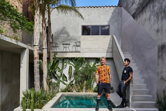 Gary Chard (left) and Feskie Rodriguez by the pool. “Our philosophy was to build a house that would mature and age gracefully,” says Chard. “It was never about chasing perfection. We wanted marks and imperfections to be part of its story.”