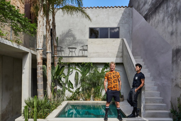 Gary Chard (left) and Feskie Rodriguez by the pool. “Our philosophy was to build a house that would mature and age gracefully,” says Chard. “It was never about chasing perfection. We wanted marks and imperfections to be part of its story.”