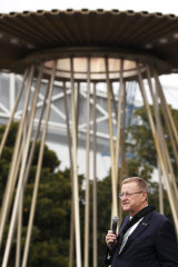 AOC President John Coates last month with the Sydney Games  cauldron at Homebush.