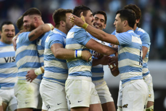 Argentina’s players celebrate after beating Scotland.