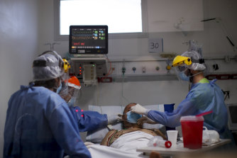 Doctors treat a COVID-19 patient inside an intensive care unit on the outskirts of Buenos Aires.
