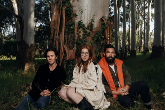 New works were created by artists (from left) Yasmin Smith, Anna May Kirk and Dean Cross, pictured here at the base of a eucalyptus tree in Centennial Parklands.
