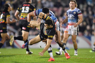 Nathan Cleary is hit late by North Queensland’s Jordan McLean.