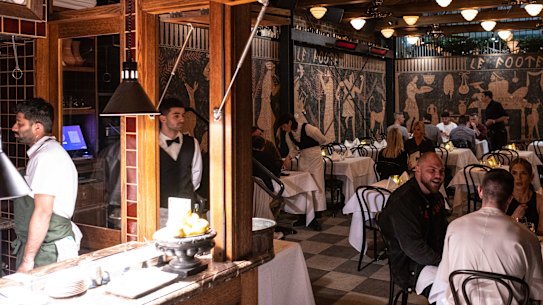 The main 50-seat dining room is lined with an Etruscan mural, giving it the air of a basement crypt.