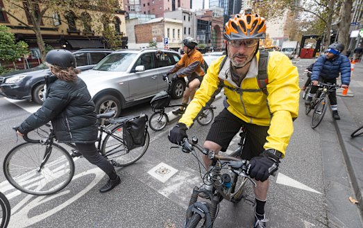 Cyclists in a protected bike lane on Friday morning.