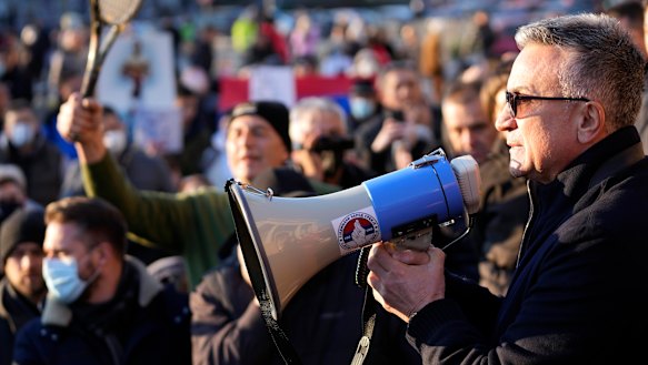 Srdjan Djokovic speaks during the protest.