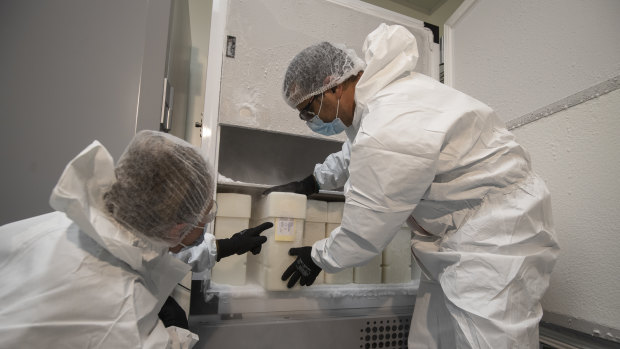CSL scientists at the company's Broadmeadows production facility with the AstraZeneca vaccine 'freezers'. The biotech giant confirmed last week that the first batches of bulk product for the vaccine had been completed. 