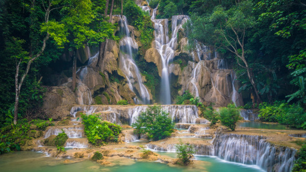 The sculptural cascades of Kuang Si Falls.