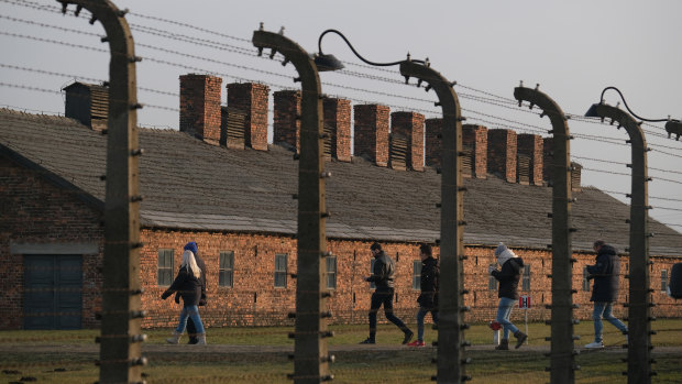 Visitors inside the former Auschwitz-Birkenau concentration camp.