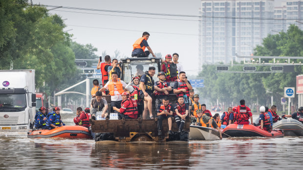 Residents in Zhuozhou, China, are evacuated from the flood-hit city. 