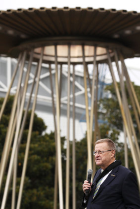 AOC President John Coates last month with the Sydney Games  cauldron at Homebush.