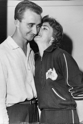 “A kiss for Barry before Marlene leave for training.” April 10, 1958.