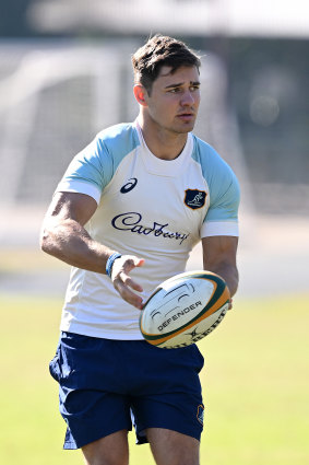 Josh Flook passes the ball at training.