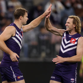 David Mundy, right, celebrates a goal with Sean Darcy.