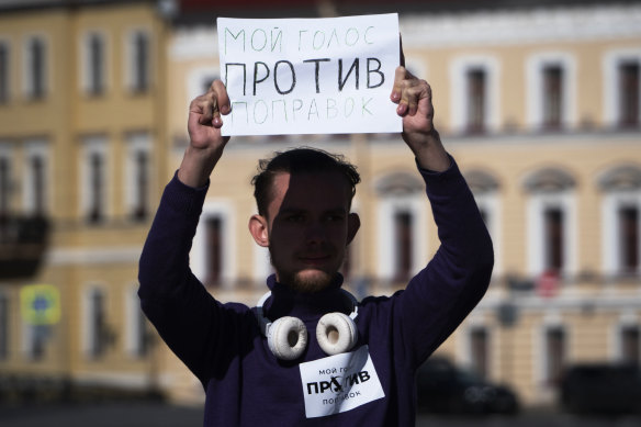 A man holds a poster reading "My vote against constitutional amendments!" during a protest against constitutional amendments at Palace Square in St Petersburg, Russia. 