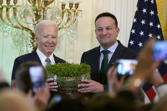 Ireland’s Prime Minister Leo Varadkar, right, presents President Joe Biden with a bowl of Shamrocks during a St Patrick’s Day reception at the White House on Sunday.