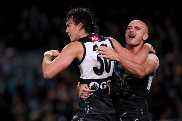 Port Adelaide’s Ollie Lord and Sam Powell-Pepper celebrate a goal during the win over the Demons.
