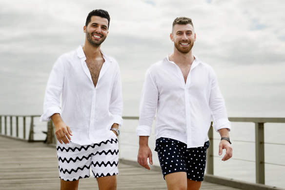 Founders of Vacay swimwear Corey Decandia  and Jordan Kallios model their board shorts  on Henley Beach Jetty, South Australia.