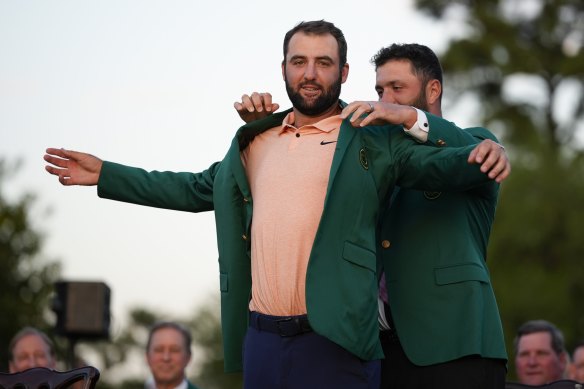 Scottie Scheffler receives the green jacket at Augusta in April.