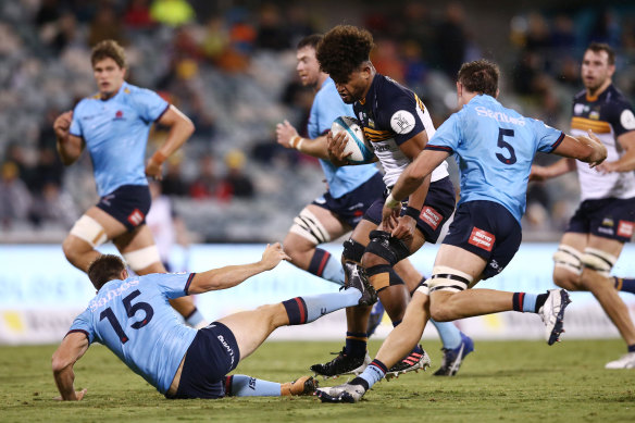 Rob Valetini bumps off Waratahs fullback Alex Newsome.
