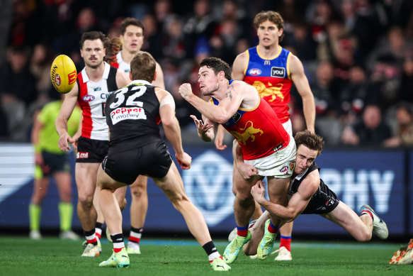 Lachie Neale is tackled by St Kilda’s Ben Paton.