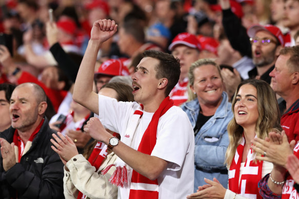 A Swans fan celebrates the win.