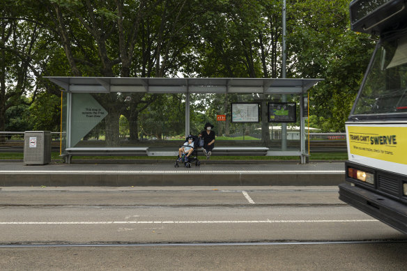 A quiet tram stop on St Kilda Road. Public transport usage dropped considerably this week amid concerns over the spread of coronavirus. 