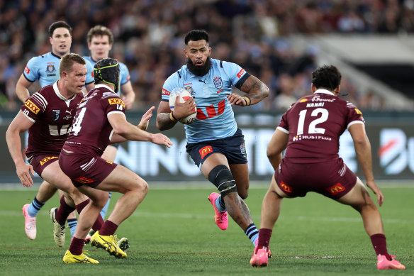 Payne Haas is tackled at the MCG. 