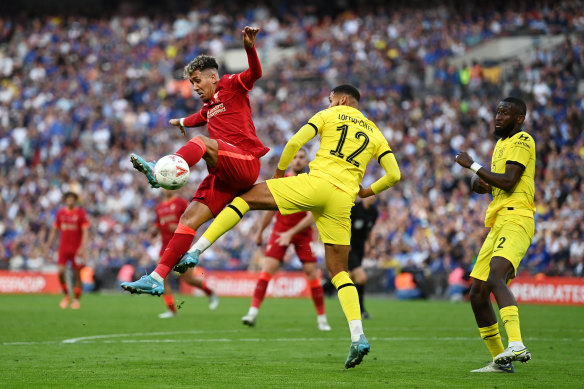 Roberto Firmino of Liverpool is challenged by Ruben Loftus-Cheek during the FA Cup final.