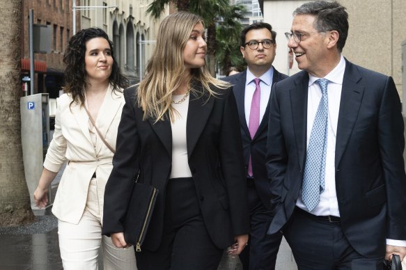 Brittany Higgins arrives at the Federal Court in Sydney on November 28 with her lawyer Leon Zwier (right) and fiance David Sharaz.