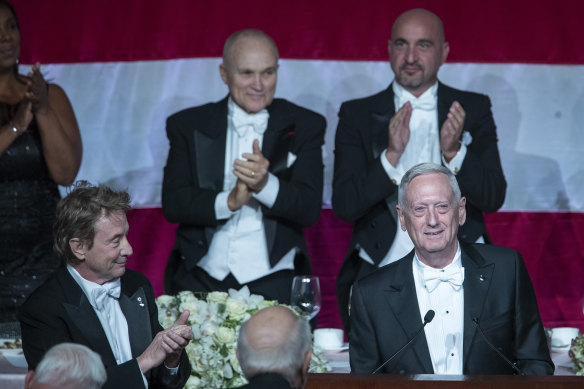 Former US secretary of defence Jim Mattis, right foreground, receives a standing ovation during the 74th Annual Alfred E. Smith Memorial Foundation Dinner.