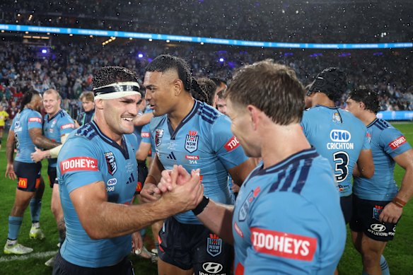 Nathan Cleary celebrates with hooker Blayke Brailey on Wednesday night.