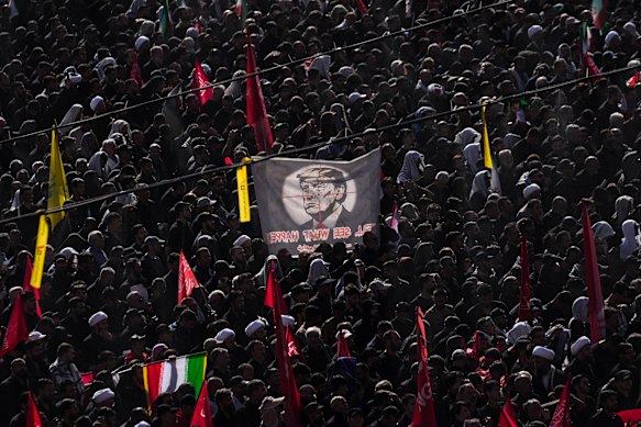 Donald Trump is in the crosshairs of a banner unfurled during the Ayatollah's funeral.