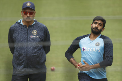 India coach Ravi Shastri looks on as paceman Jasprit Bumrah prepares to let one fly at training.