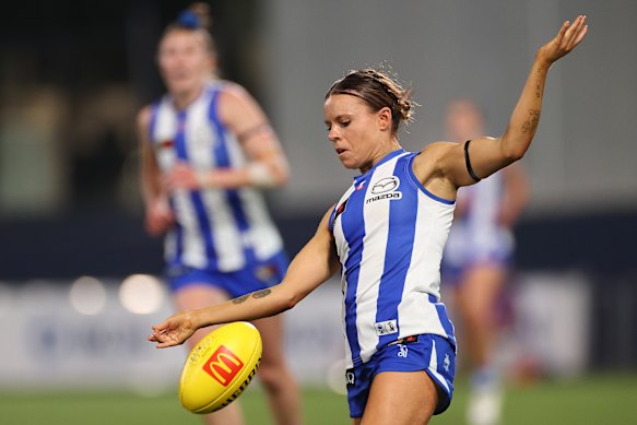 Jenna Bruton gets a kick away against the Dees.